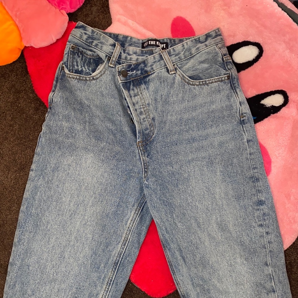 Asymmetrical waist jeans